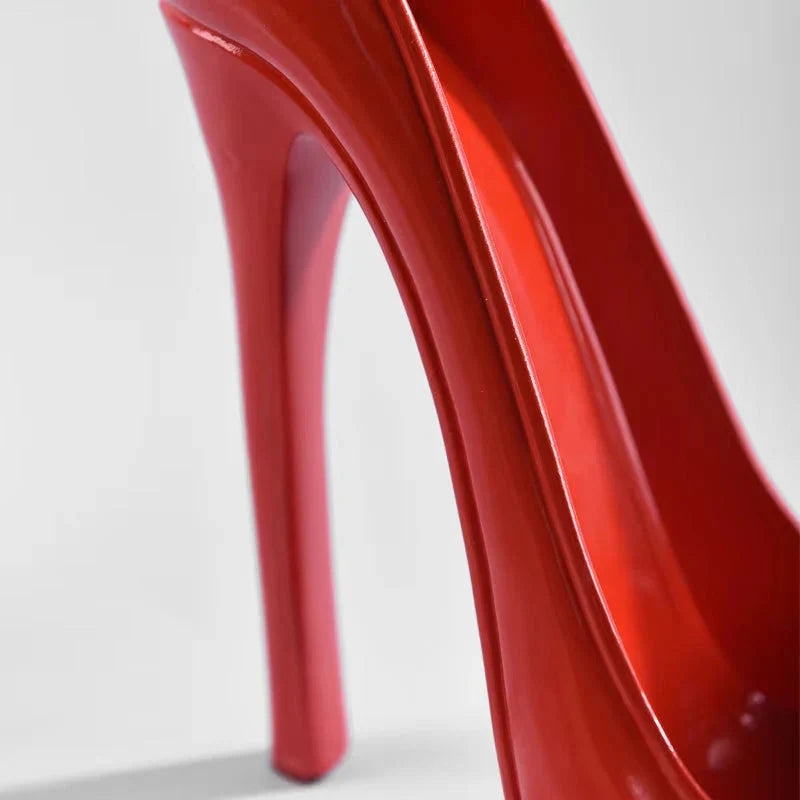 Glossy red high heel shoe with sleek stiletto design, modern fashion footwear