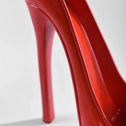 Glossy red high heel shoe with sleek stiletto design, modern fashion footwear