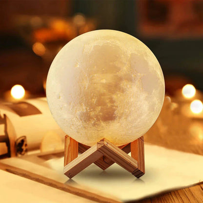 Glowing 3D moon lamp on wooden stand, cozy night light for bedroom decor