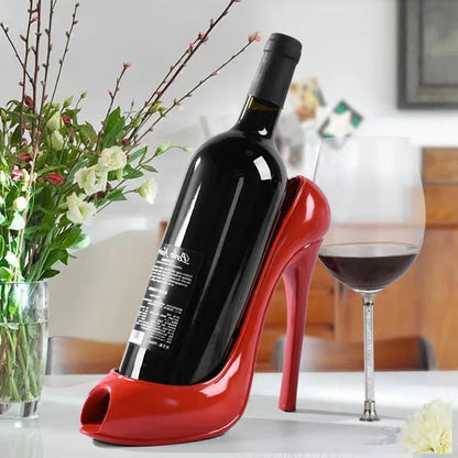 Red high heel wine bottle holder with glass of red wine, cozy home decor accent