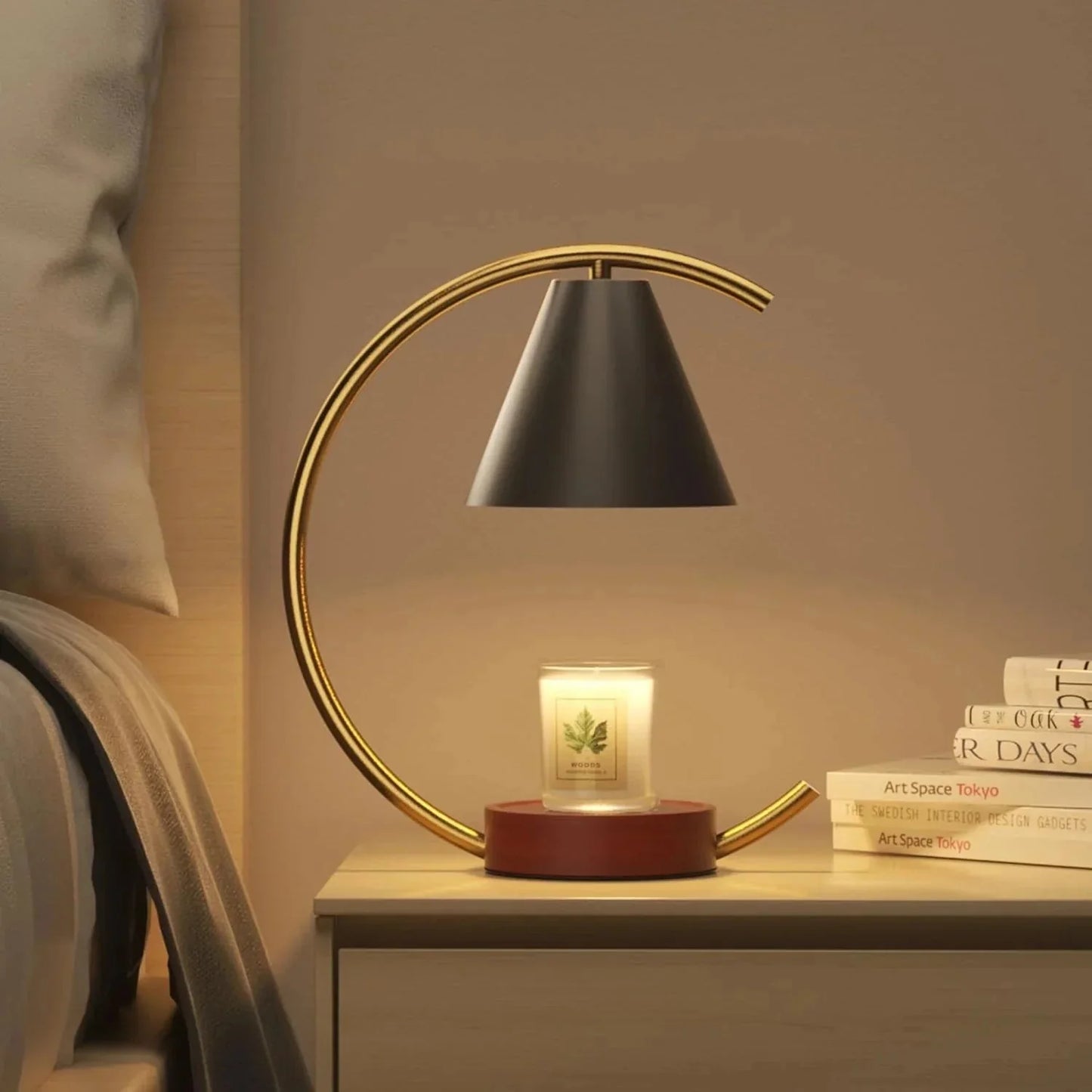 Modern gold arc lamp with black shade on bedside table, glowing candle, cozy bedroom ambiance
