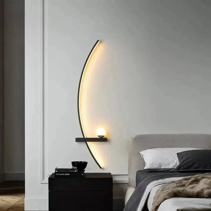Modern crescent wall sconce with warm glow, perfect for cozy bedroom ambiance and contemporary home decor.