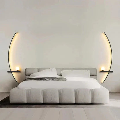 Modern gray upholstered bed with curved wall sconces, cozy white bedding, minimalist bedroom decor