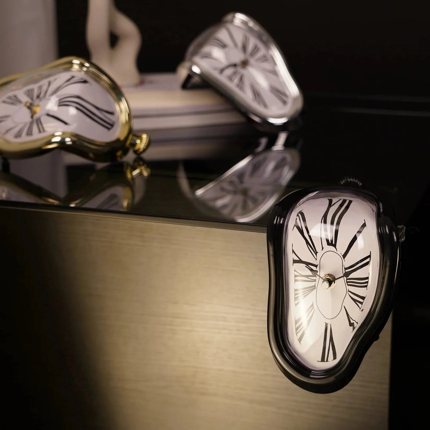 Surreal melting clock decor with Roman numerals, modern home accent on reflective surface